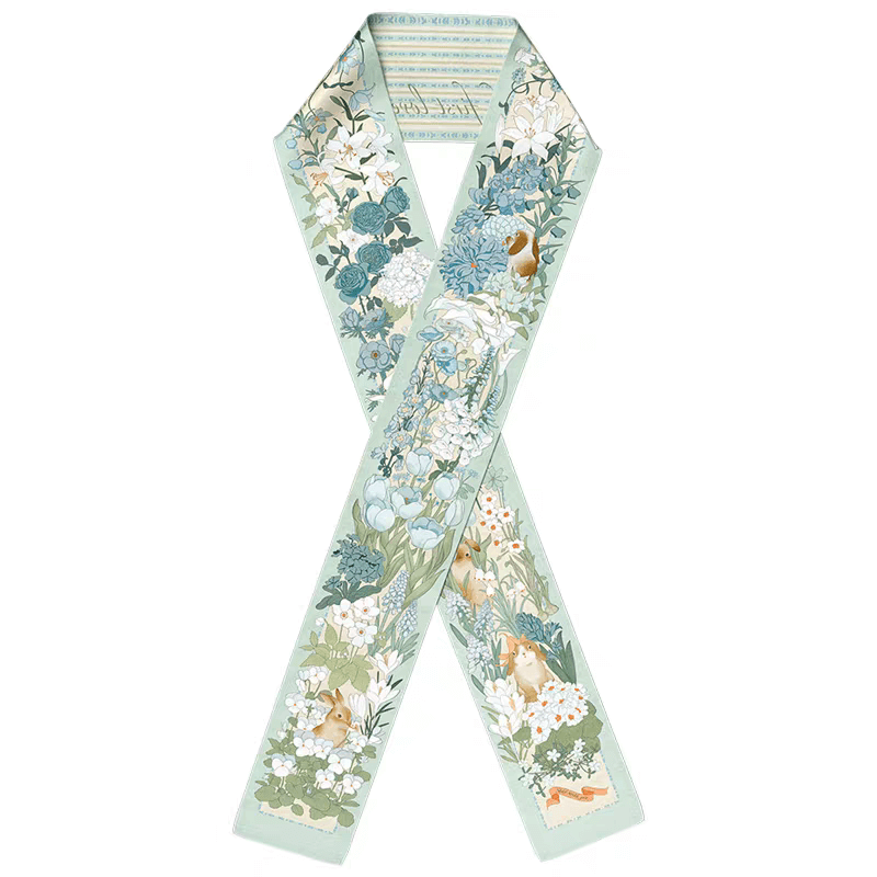 Enchanted Garden Silk Scarf: Whimsy in Motion in light blue