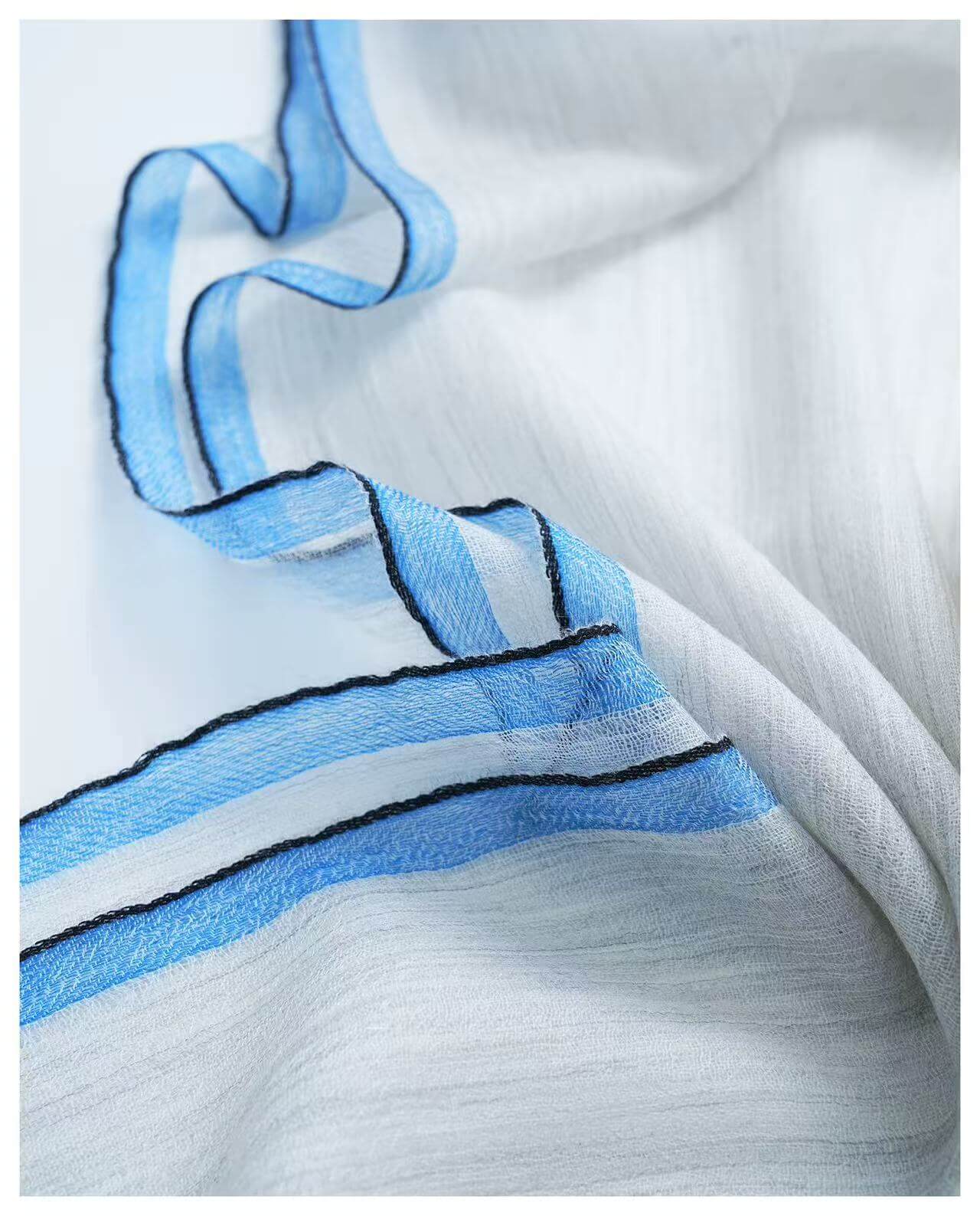 soft breathable cashmere travel wrap in neutral tones