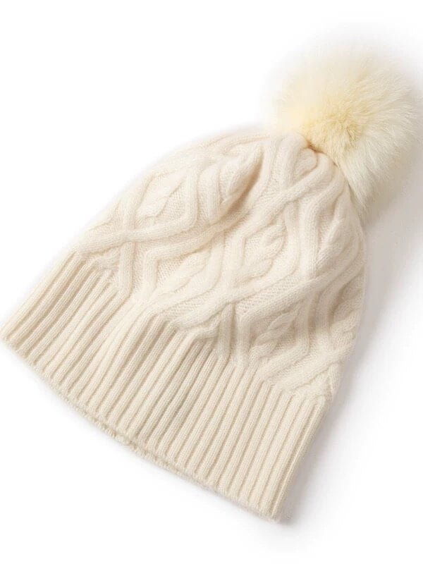 Side view of luxury cashmere pom pom hat
Cable knit and diamond texture cashmere hat