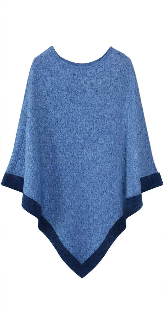Two-tone cashmere poncho in light blue with dark blue trim, cable-knit, flat lay front view