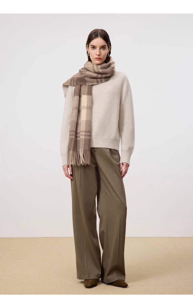 Soft undyed cashmere shawl draped over shoulders