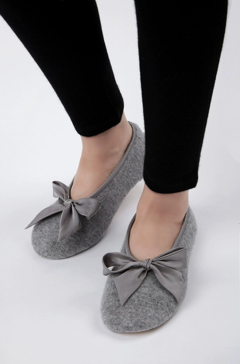 Woman wearing 100% pure cashmere travel slippers at home, lightweight luxury ballet house shoes for everyday comfort