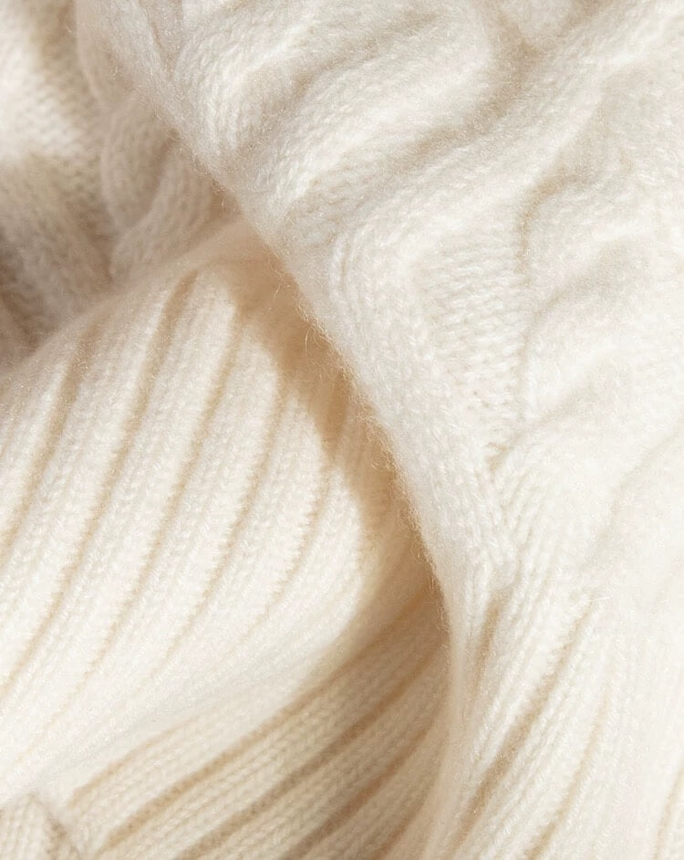 Cashmere hat with detachable fox fur pom
Front view of cashmere cable knit pom pom hat