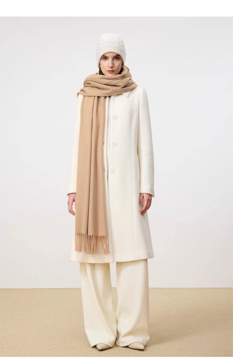 Hand-twisted fringe detail on woven cashmere scarf