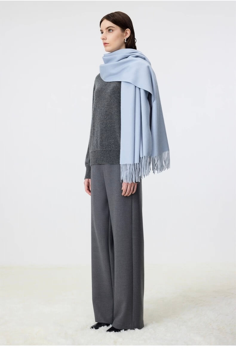 Woman wearing a light blue 100% cashmere scarf  shawl for women