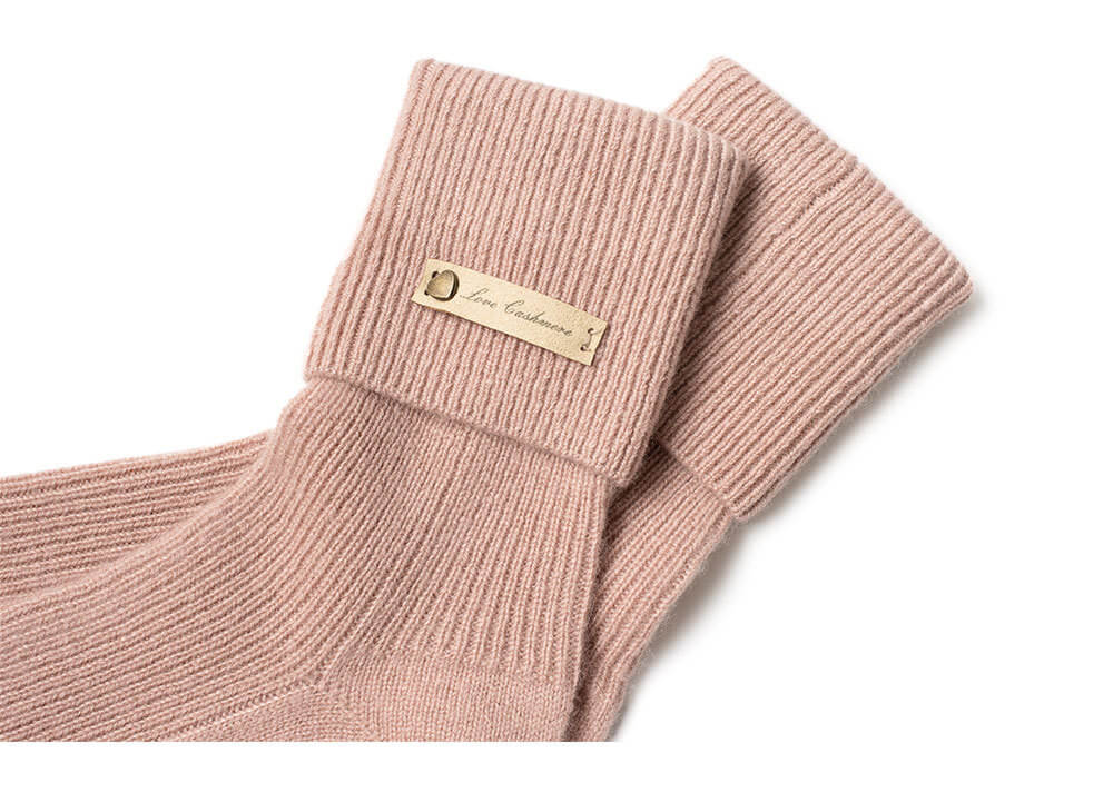 Pure pink cashmere socks for women, soft ribbed knit for warmth and comfort.