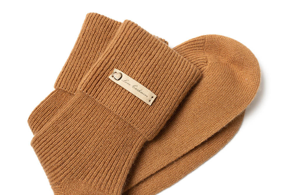 Cozy pumpkin color cashmere socks, women’s ribbed knit style for fall and winter.